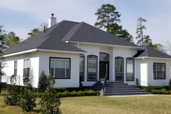 Shingle Roof on a white house, installed by Pride Roofing LLC